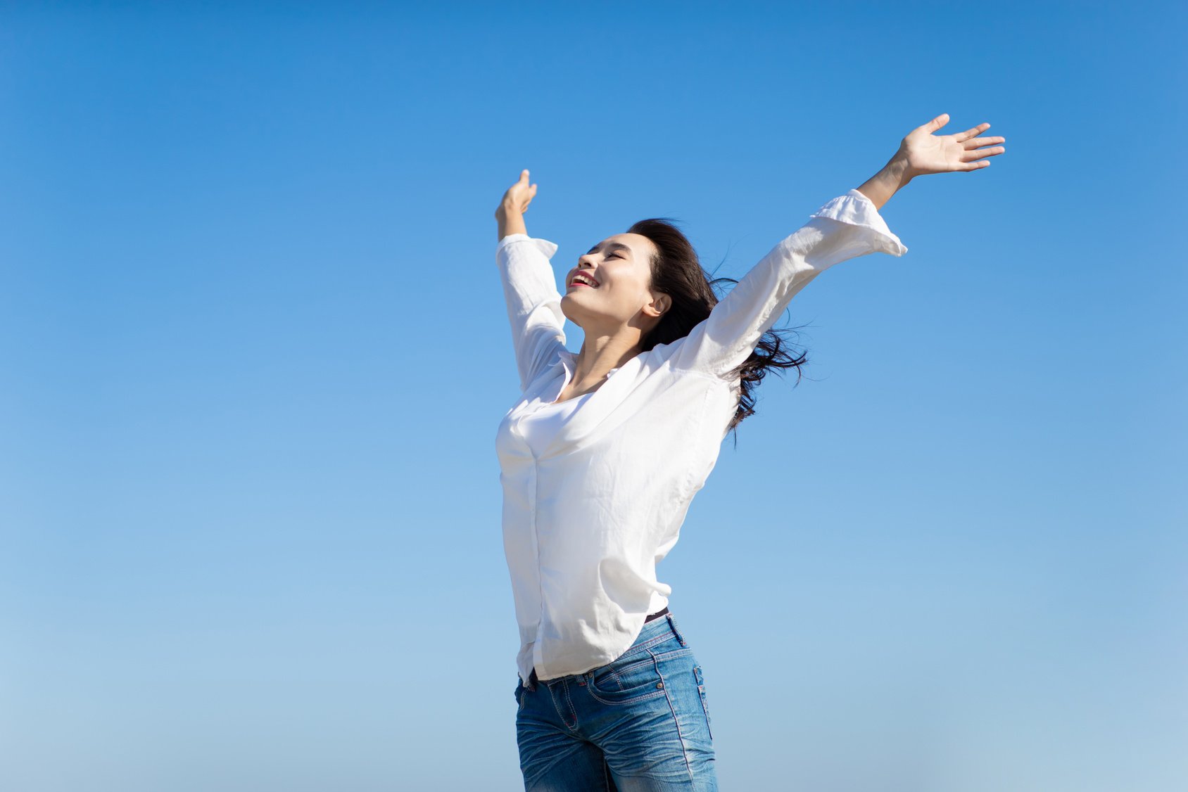 Asian Woman Cheering Open Arms