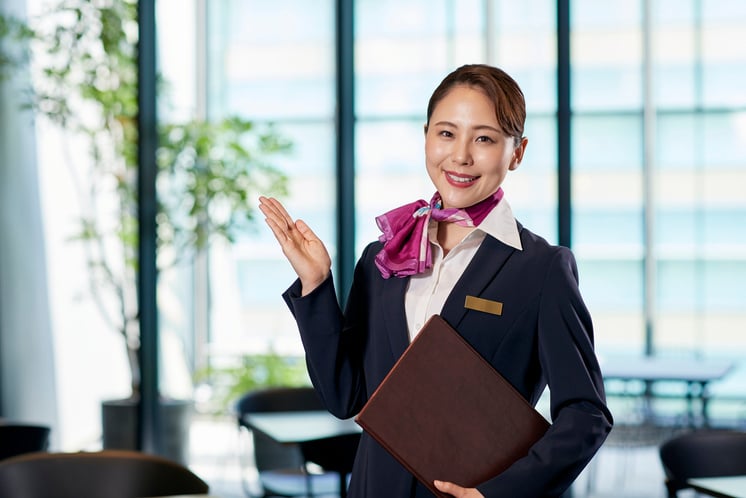 Smiling Female Receptionist in Professional Attire