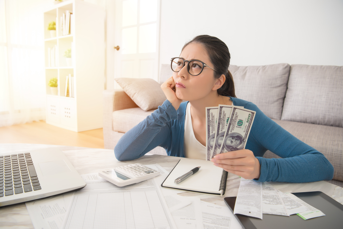 Woman Worried about the Expenses at Home